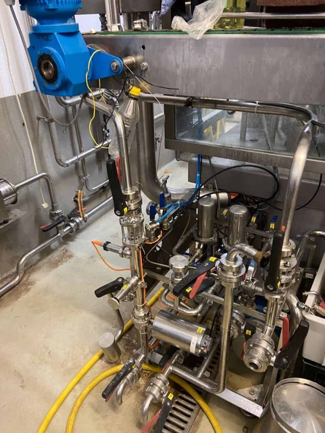 Seitenansicht der Nagel, PAC, Juwatec, ICS Mehrweg-Glasabfüllanlage für Bier, Softdrinks